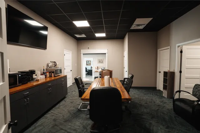 a view of a workspace with furniture