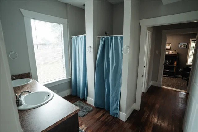 a kitchen with sink and refrigerator