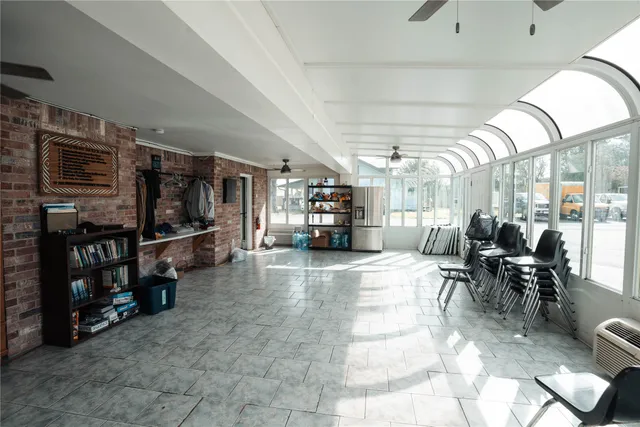 a living room with lots of furniture and a flat screen tv
