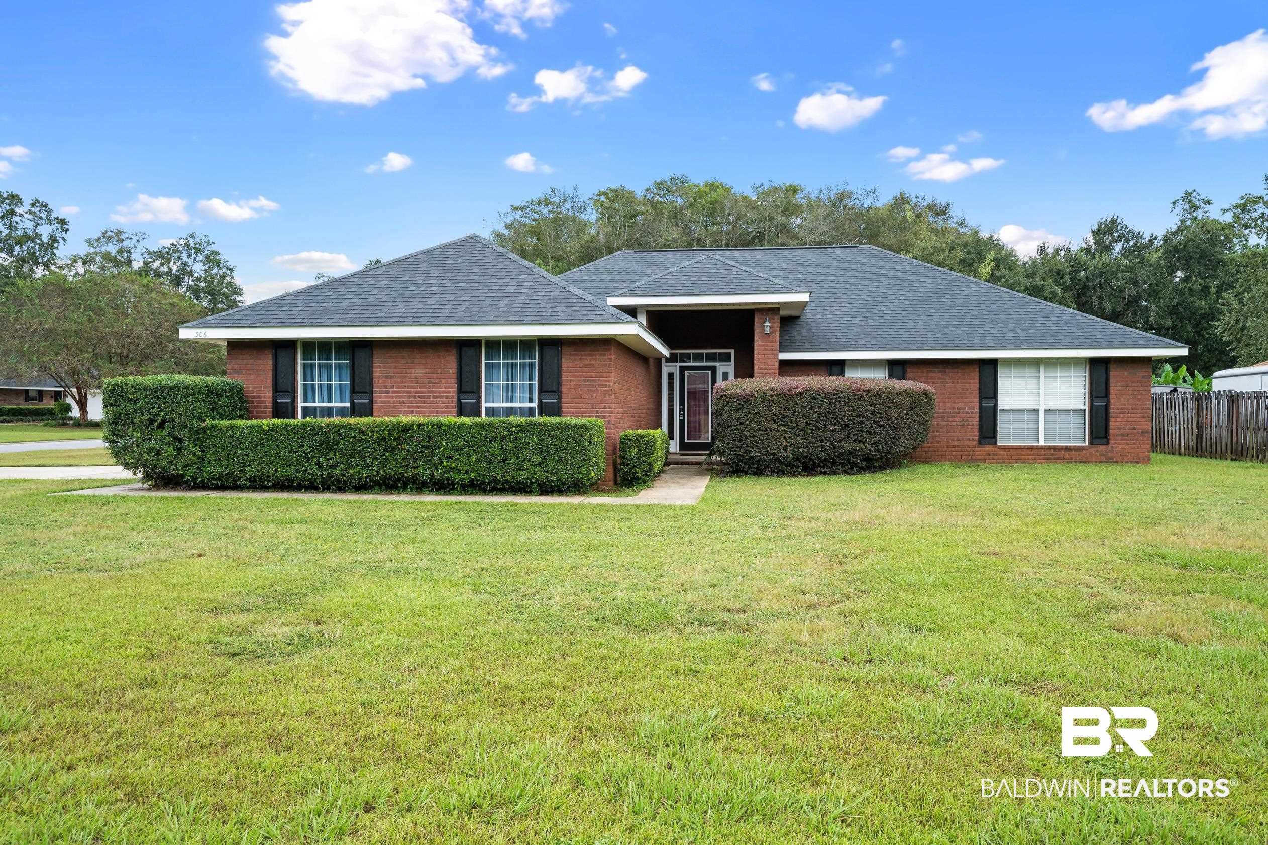 306 Monteith Oaks Drive Foley, AL 36535 - Photo 1 of 38 Ranch-style home featuring roof with shingles and brick siding