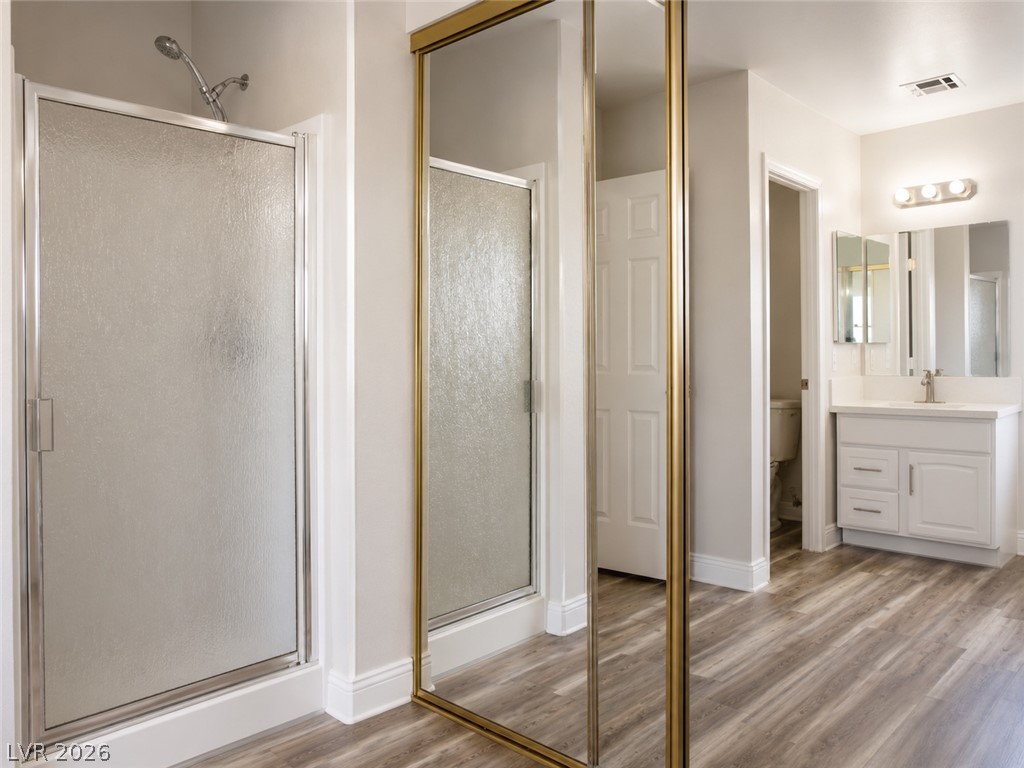 200 East Gamebird Road Pahrump, NV 89048 - Photo 15 of 23 A well-appointed bath features a shower with glass enclosure and vanity with ample storage.