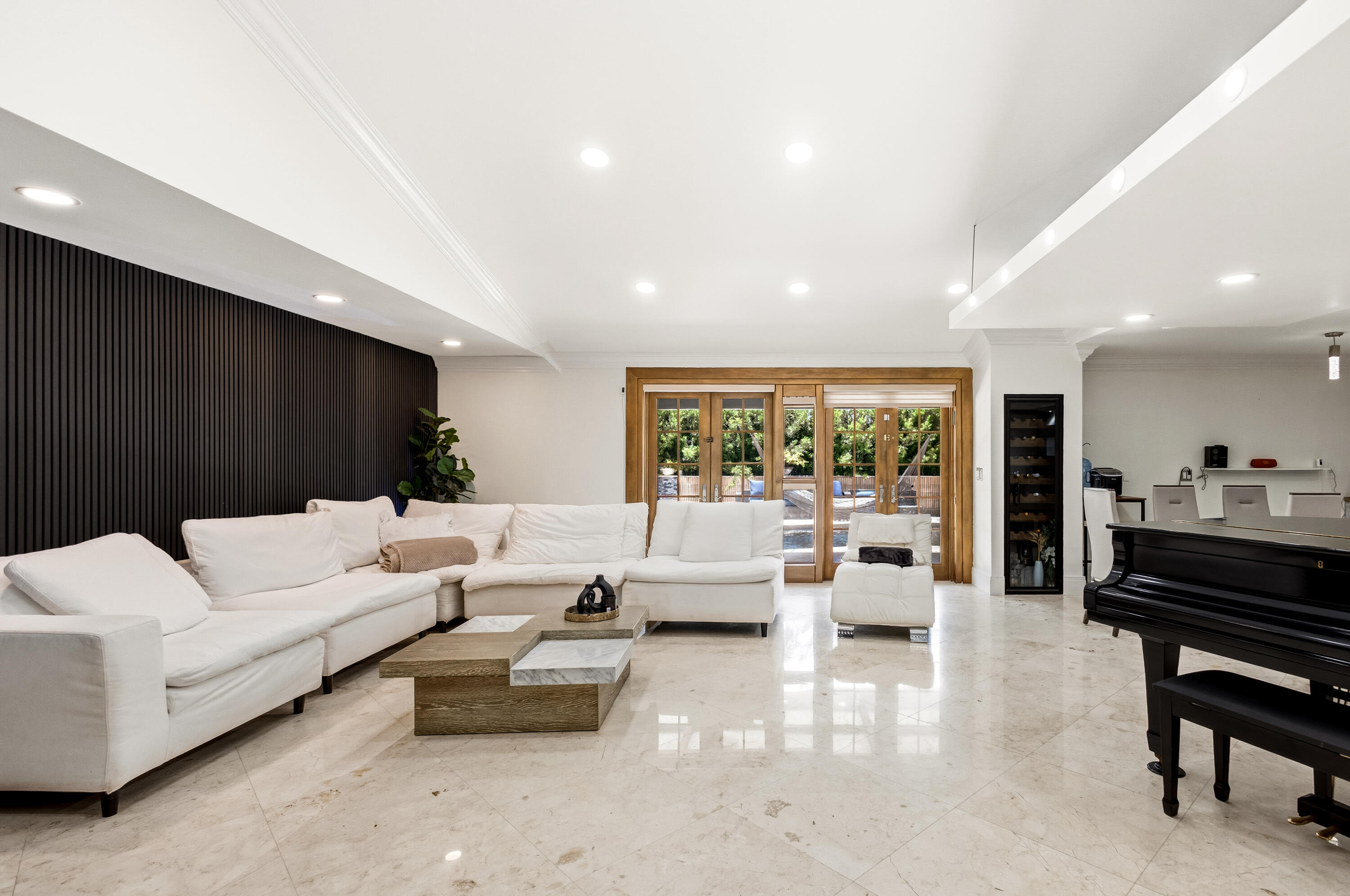 5223 Deerhurst Crescent Circle Boca Raton, FL 33486 - Photo 14 of 51 a living room with furniture and a glass door