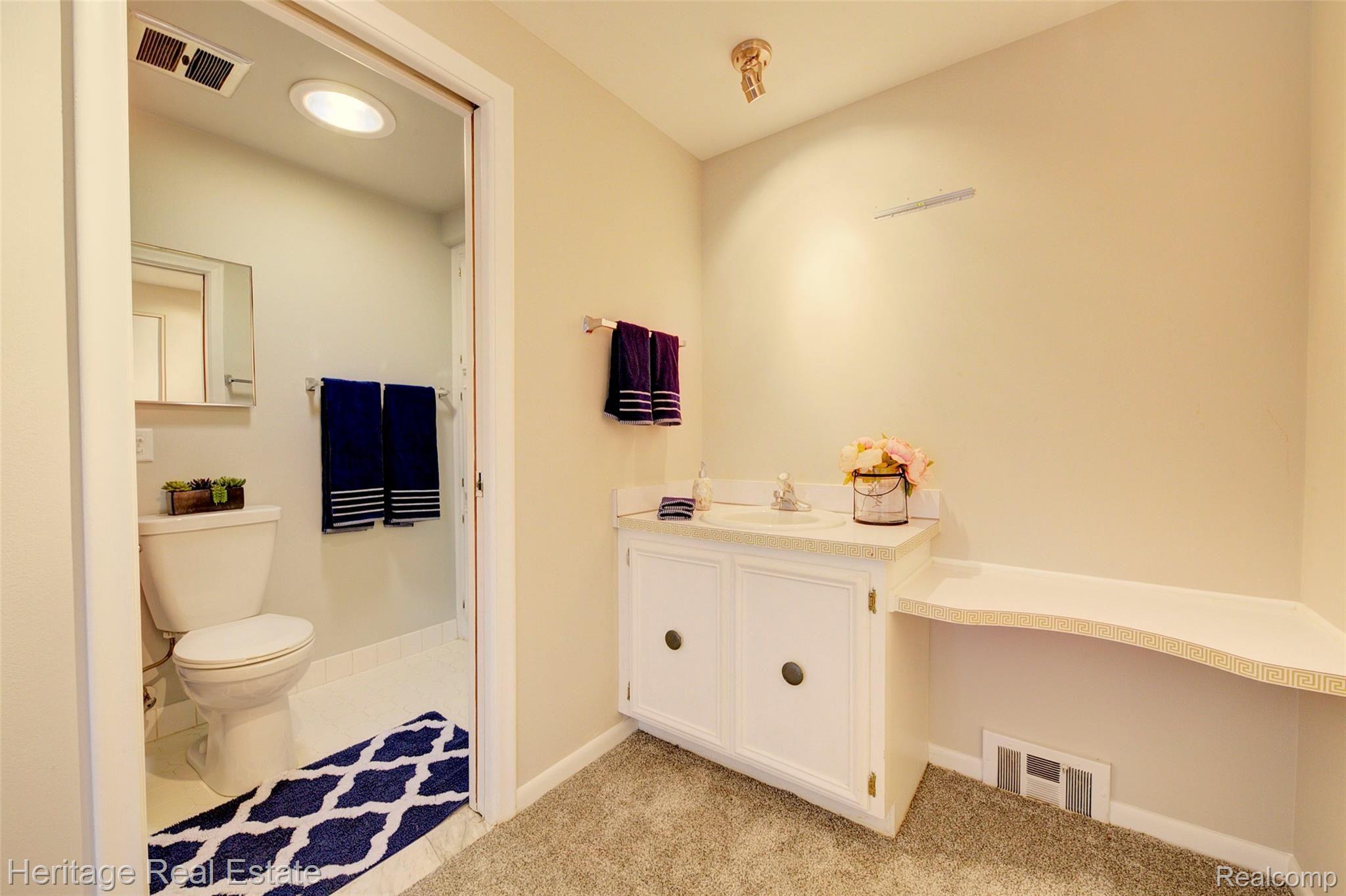 654 Old Perch Road Rochester, MI 48309 - Photo 35 of 61 Master bathroom features a vanity area and separate toilet/shower area