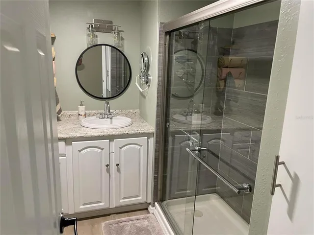 a view of a hallway with windows and stairs