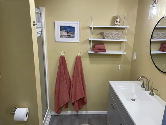 a bathroom with a sink and a mirror