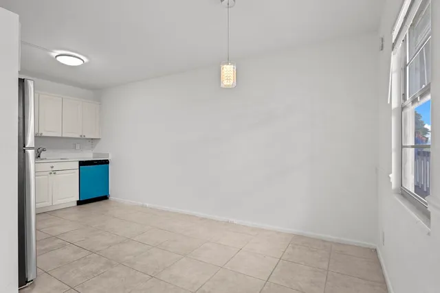 a view of room with window and hardwood