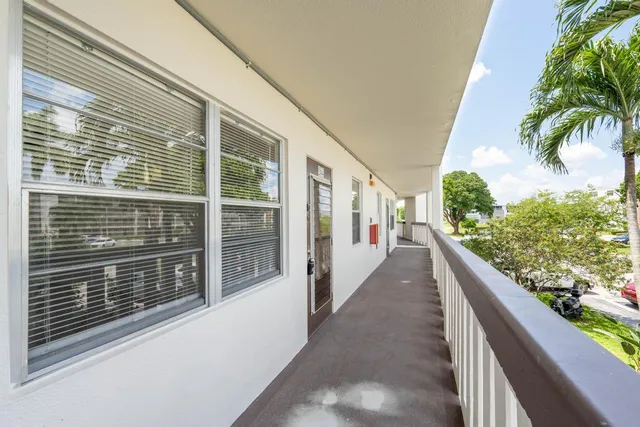 a view of a balcony with potted plants