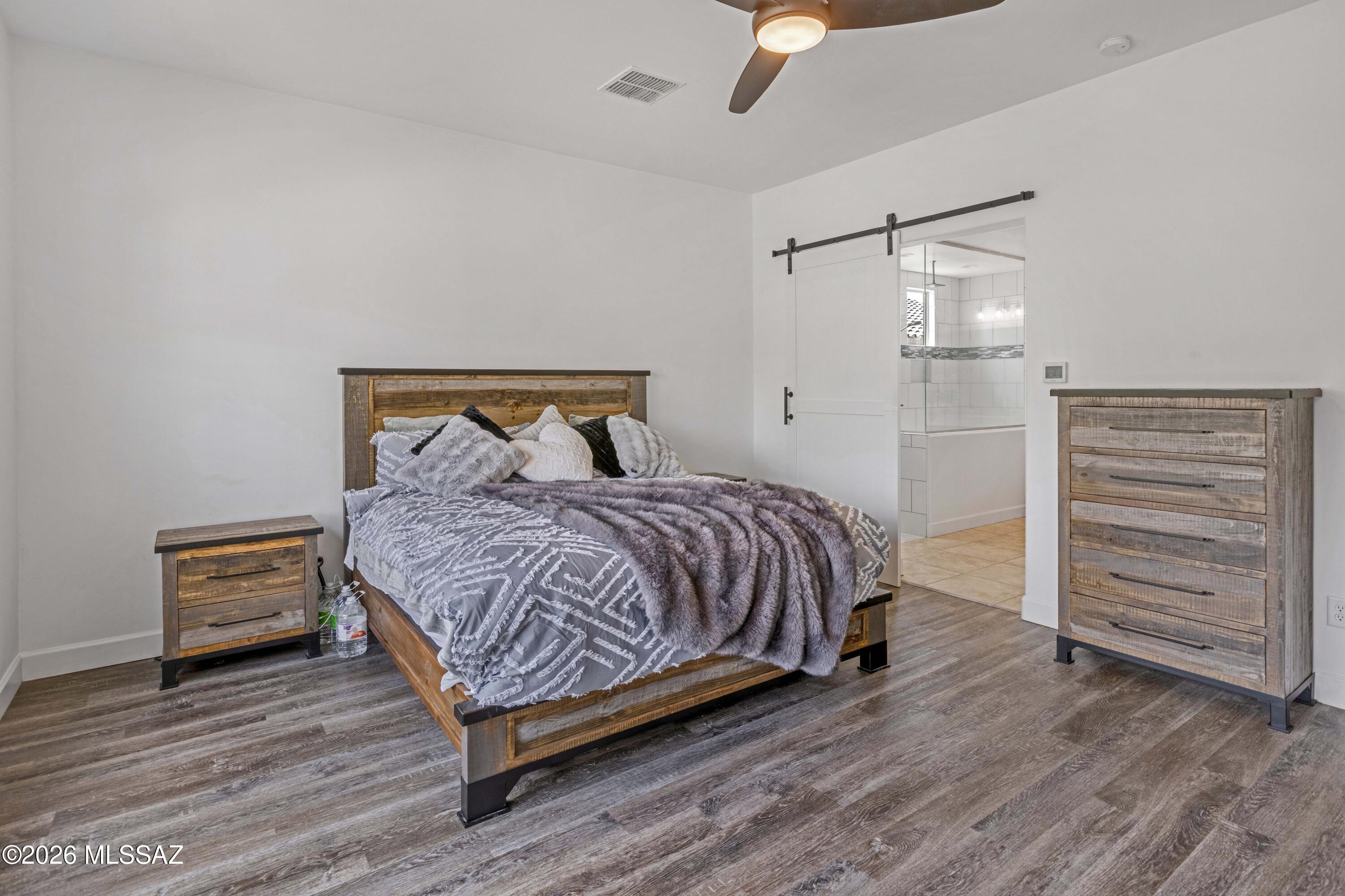 61827 East Quartzite Road Oracle, AZ 85623 - Photo 20 of 50 Barn Door to Master Bath