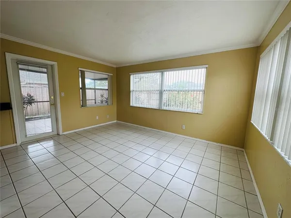 a view of an empty room and window