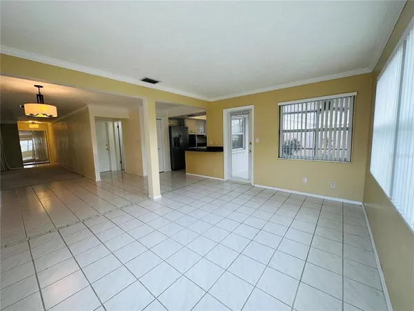 a view of an empty room and window