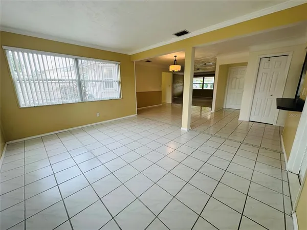 a view of an empty room and a window