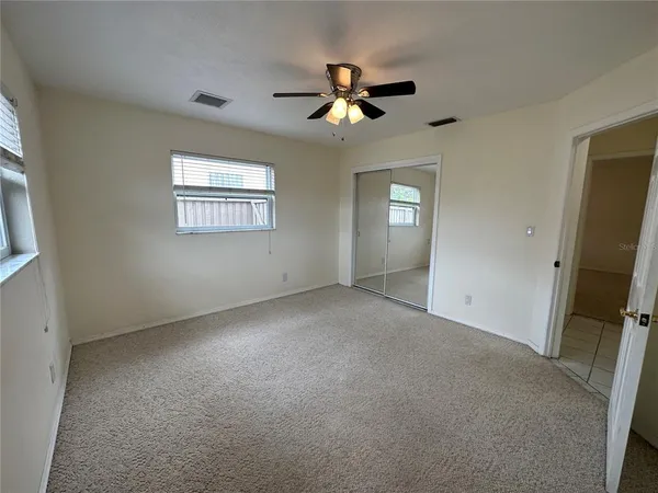 a view of an empty room with a window