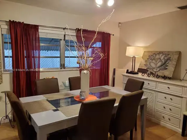 a view of a dining room with furniture