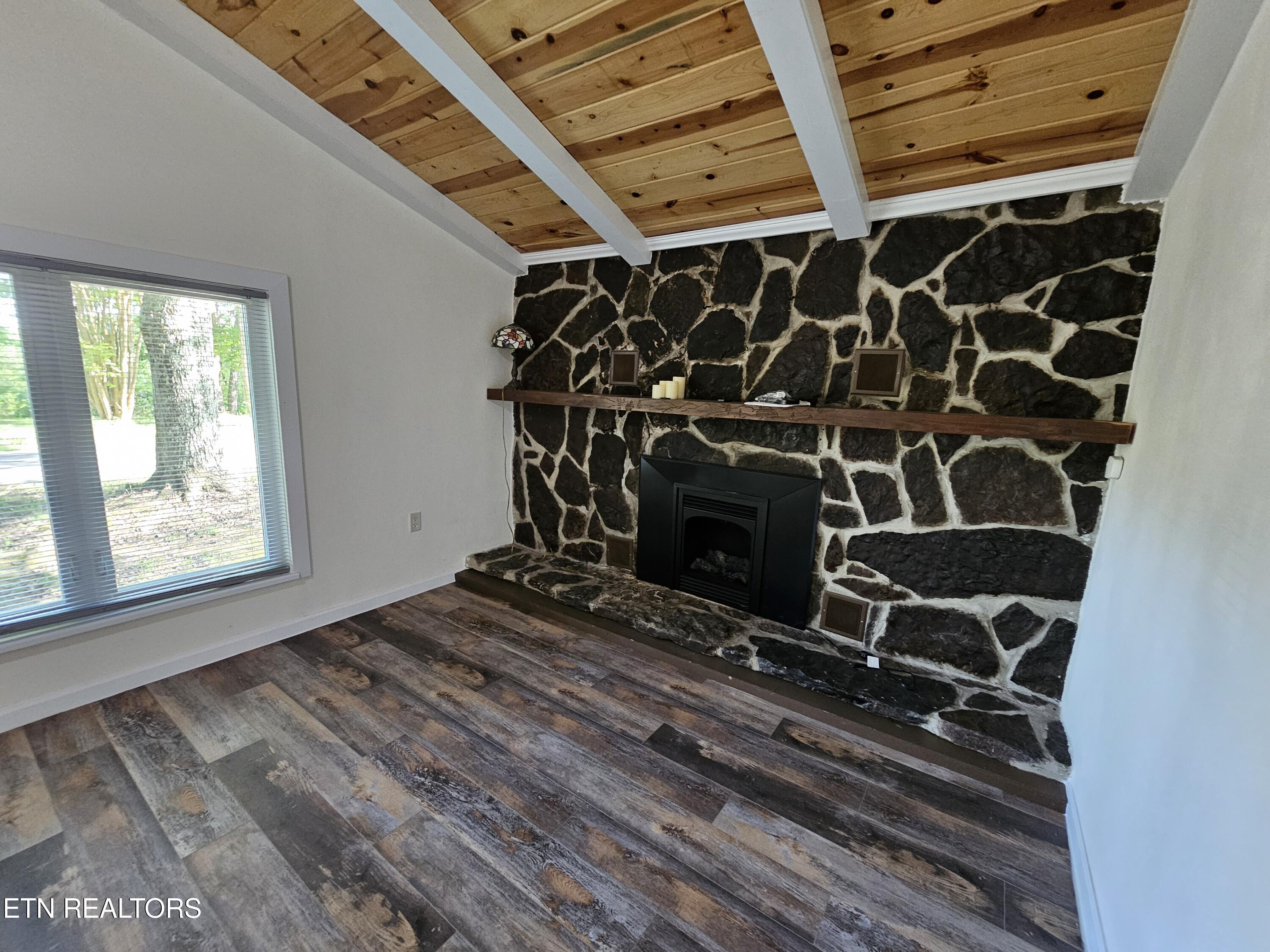 355 Eli Lane Oneida, TN 37841 - Photo 34 of 58 Stone Fireplace with Gas Logs