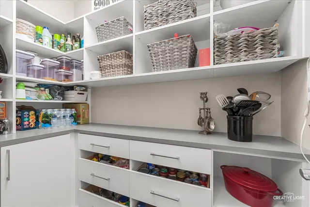 a shelf with cup and plates