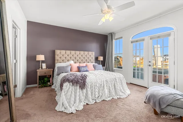 a bed room with a bed and a chandelier