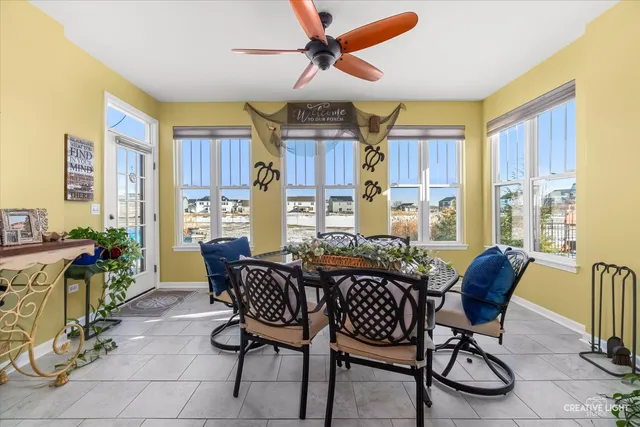 a dining room with furniture and window