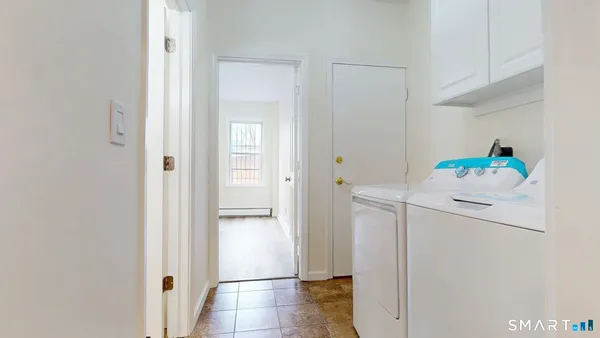 a white refrigerator freezer sitting inside of a kitchen