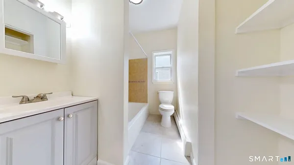 a view of a bathroom with a sink and a toilet