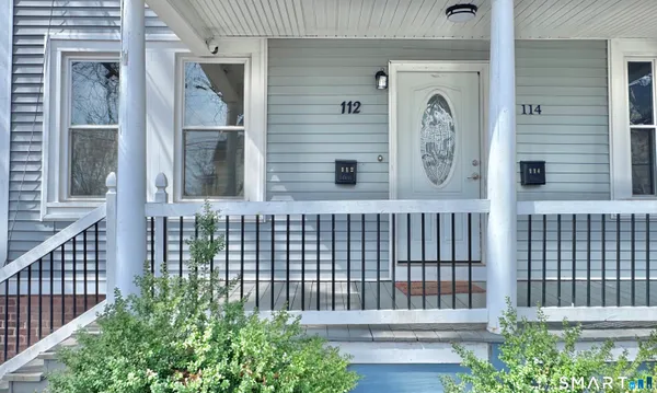 a front view of a house with a porch