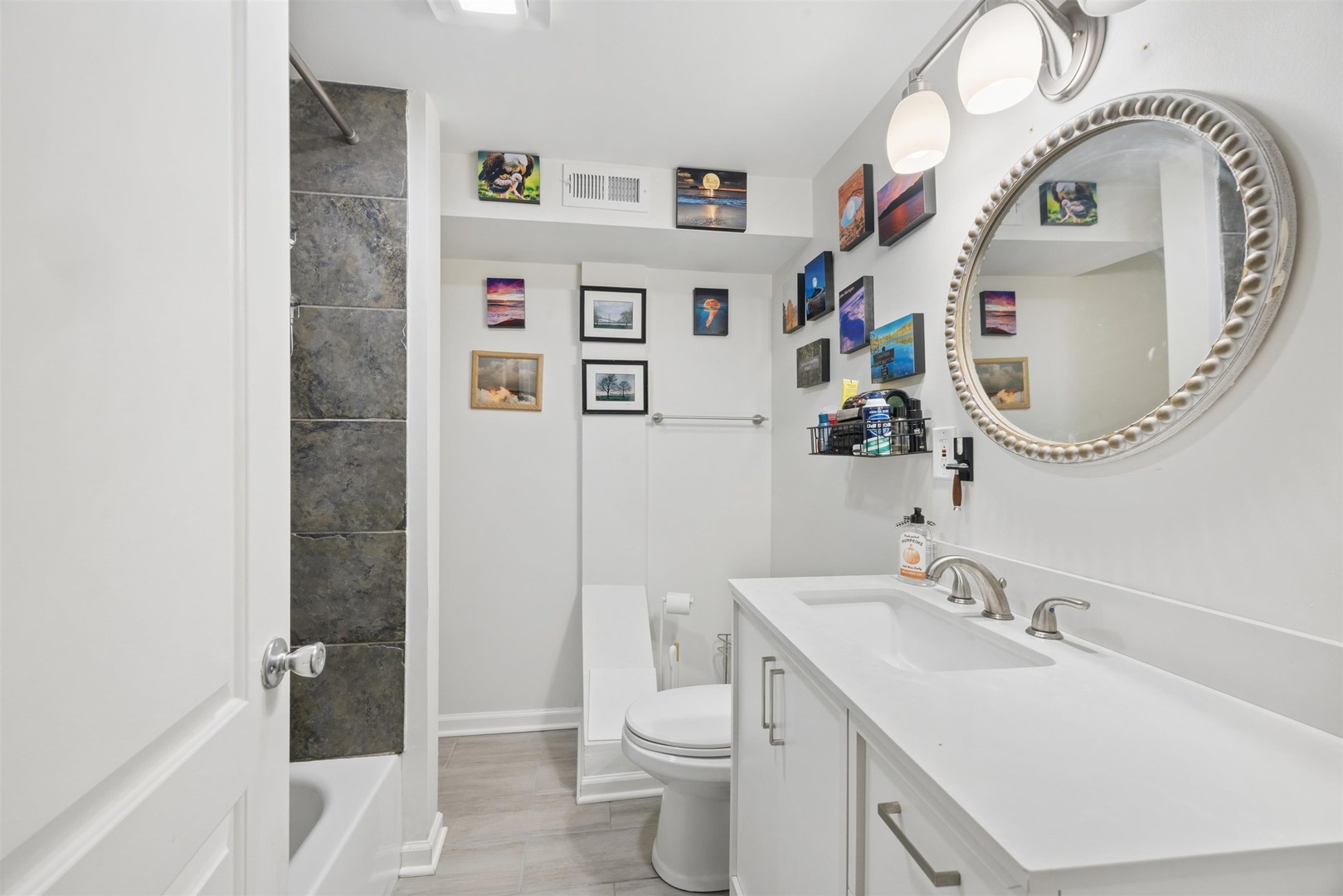 1120 Dobson Street Evanston, IL 60202 - Photo 9 of 21 a bathroom with a sink a toilet and a mirror