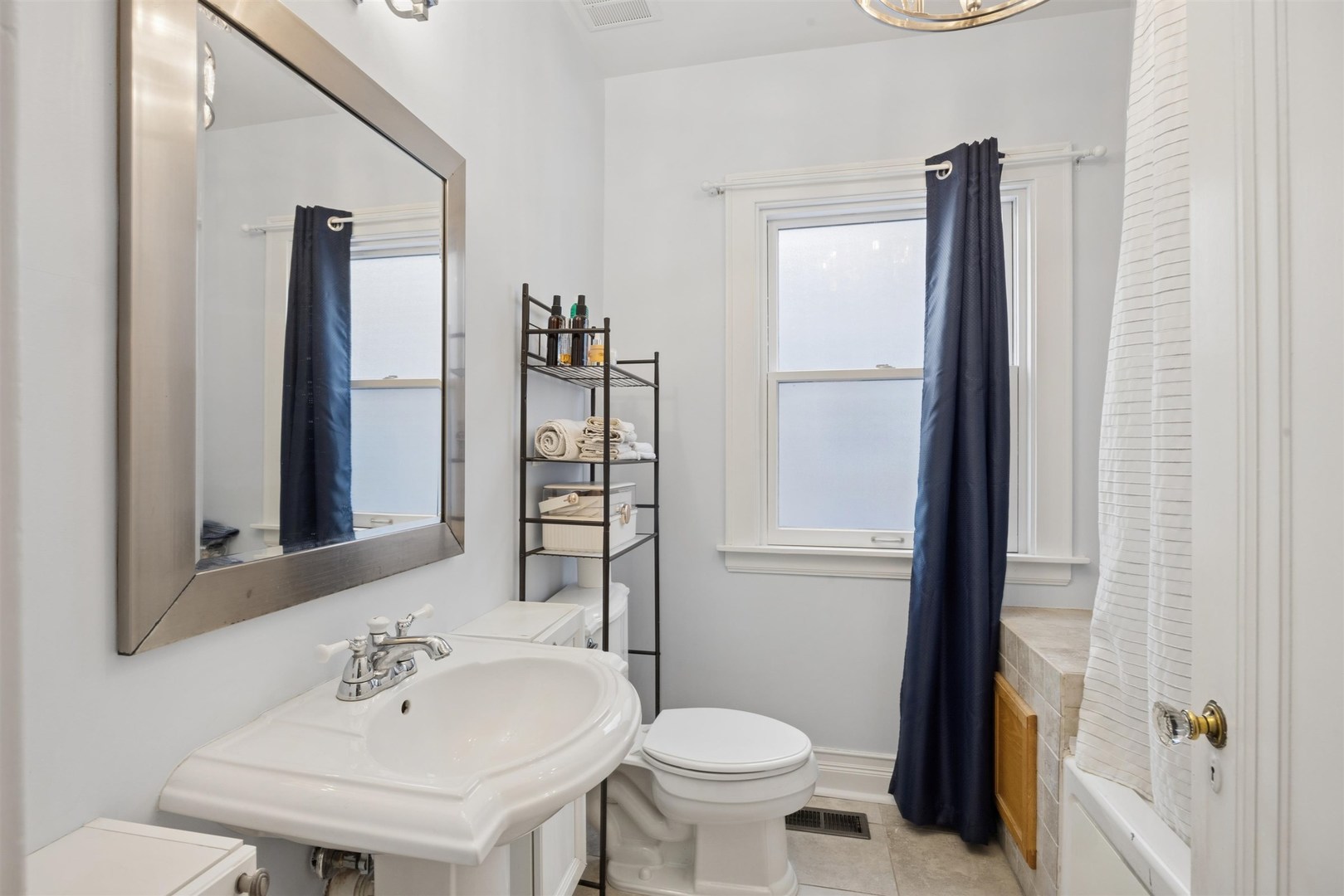 1120 Dobson Street Evanston, IL 60202 - Photo 10 of 21 a bathroom with a sink toilet and mirror