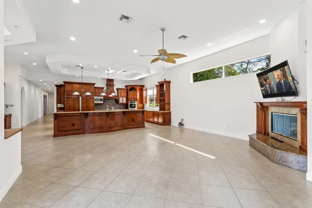 a spacious bathroom with a double vanity sink a large mirror and bathtub