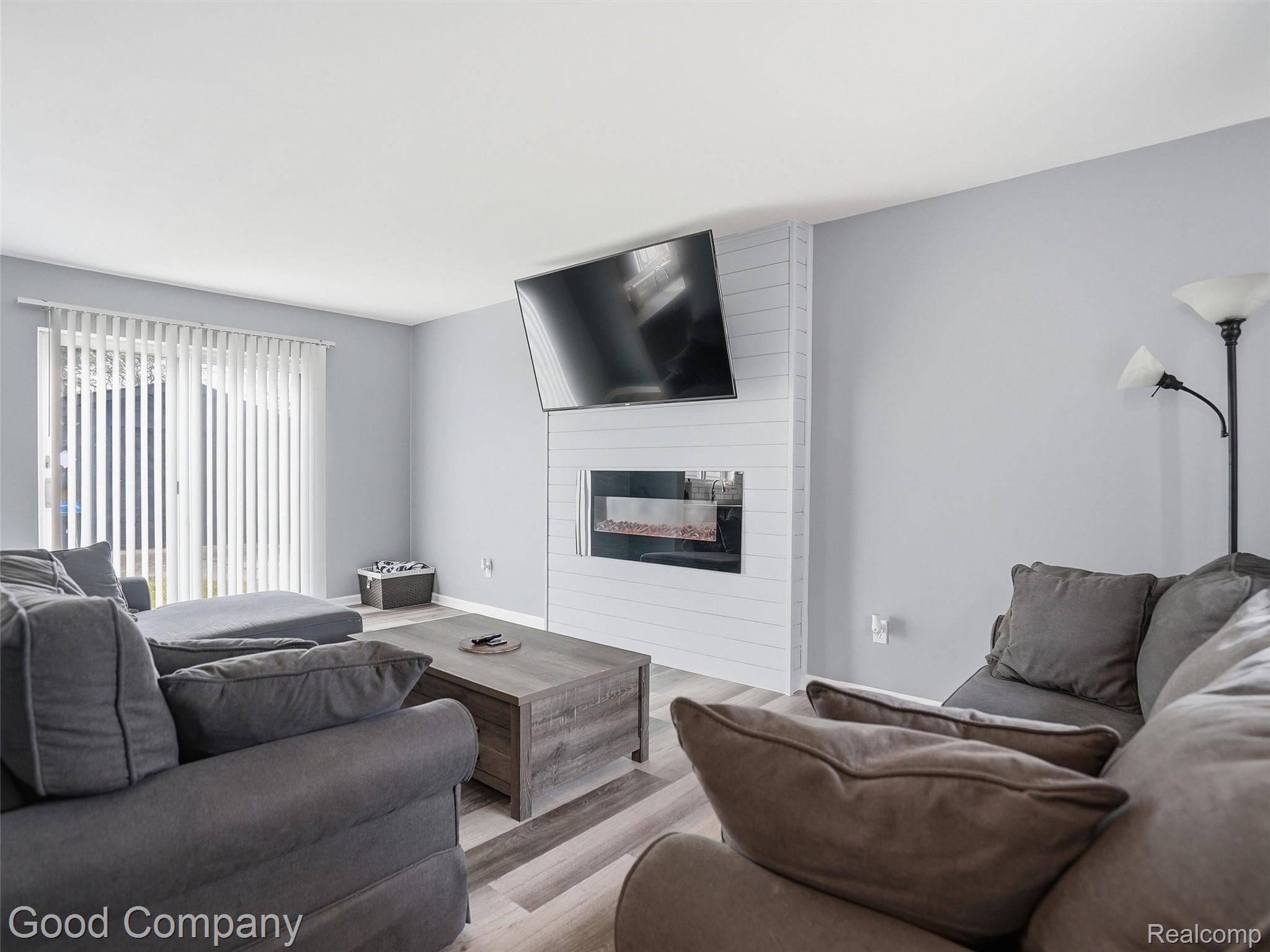 30632 Hayes Road Roseville, MI 48066 - Photo 6 of 32 Living area featuring wood-finish flooring and light gray wall paint