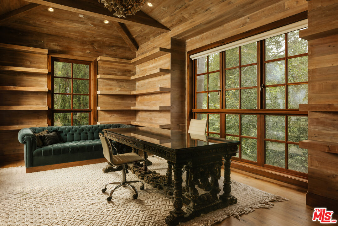 1105 Rivas Canyon Road Pacific Palisades, CA 90272 - Photo 17 of 49 a view of a workspace with furniture and a window