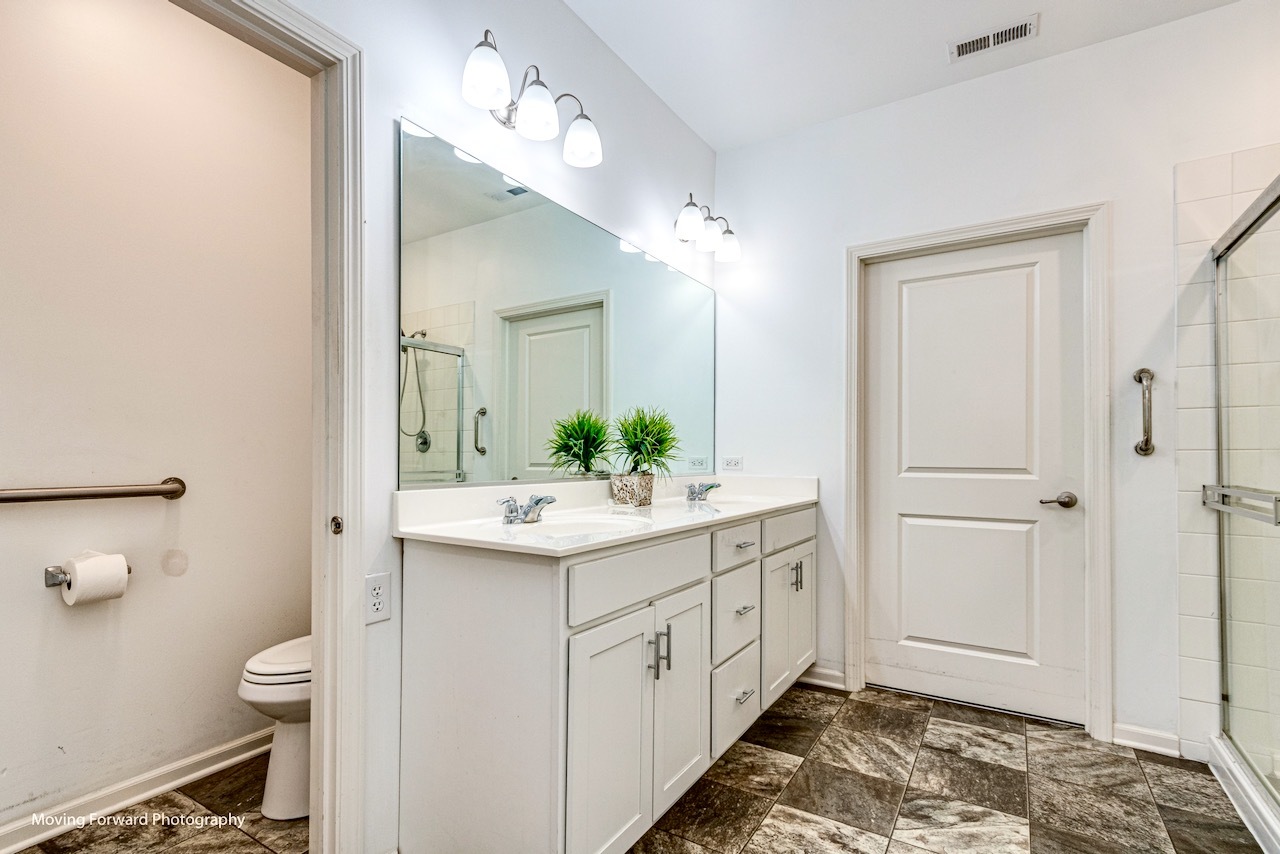 1908 Southern Circle, Unit 1908 Pingree Grove, IL 60140 - Photo 14 of 30 a bathroom with a sink and a mirror