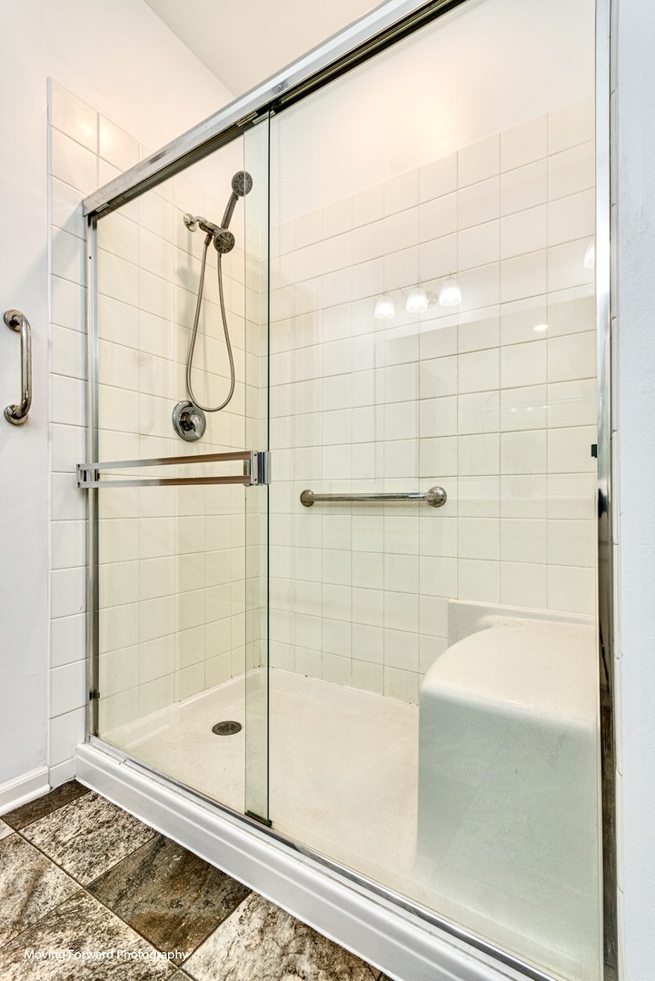 1908 Southern Circle, Unit 1908 Pingree Grove, IL 60140 - Photo 15 of 30 a bathroom with a shower and a bathtub
