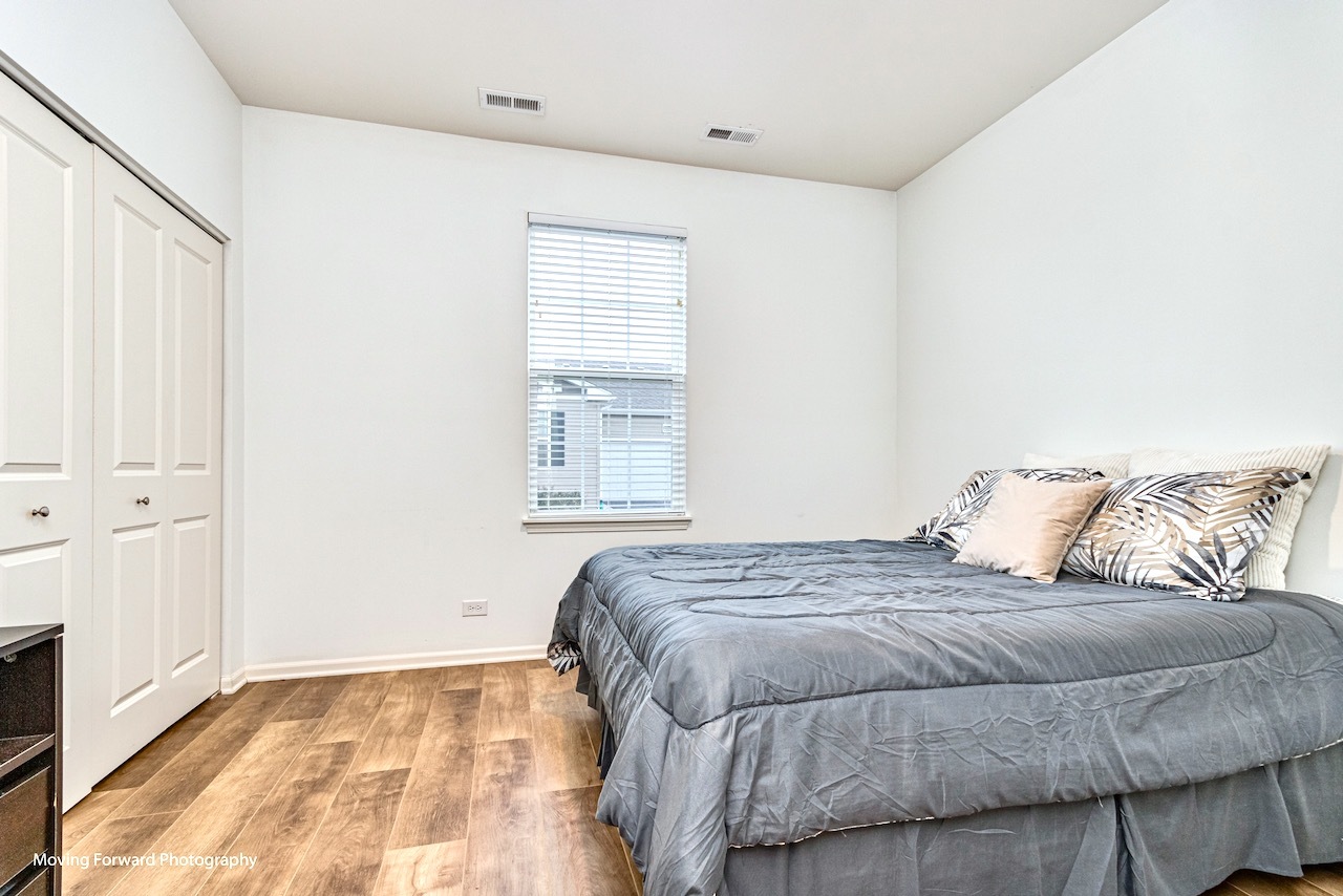 1908 Southern Circle, Unit 1908 Pingree Grove, IL 60140 - Photo 16 of 30 a bedroom with a bed and a window
