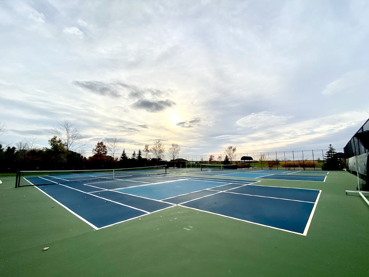 1908 Southern Circle, Unit 1908 Pingree Grove, IL 60140 - Photo 27 of 30 a view of tennis court with lots of trees in the background
