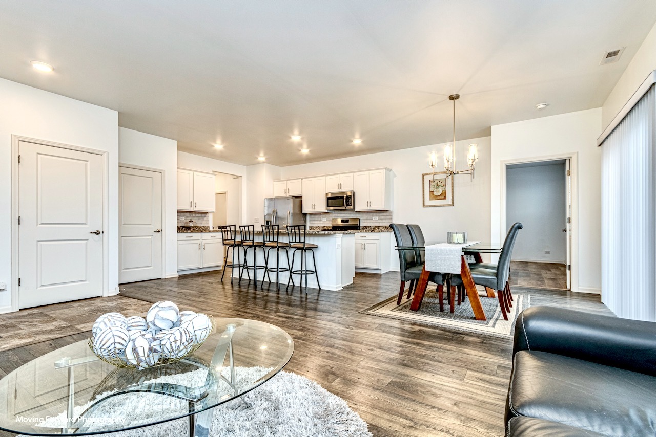 1908 Southern Circle, Unit 1908 Pingree Grove, IL 60140 - Photo 3 of 30 a dining room with furniture and wooden floor