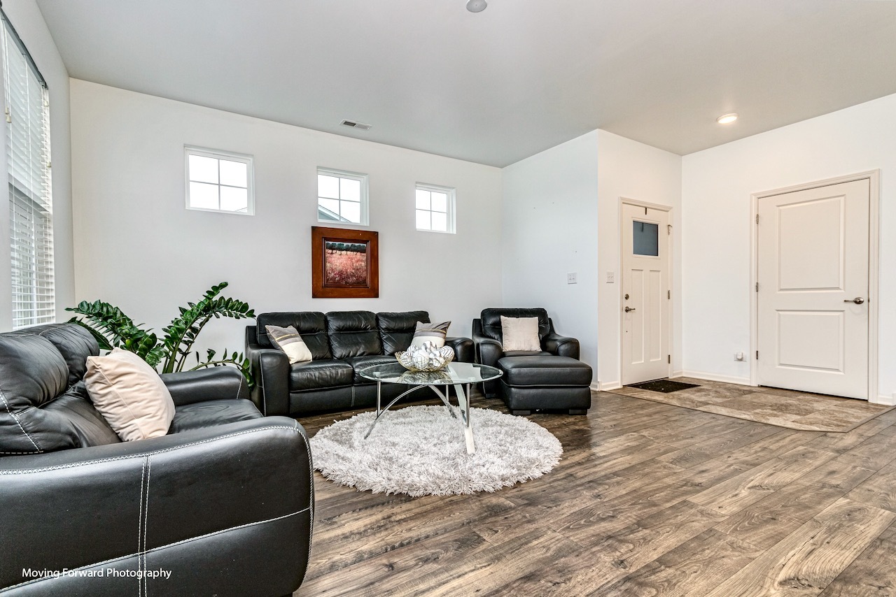 1908 Southern Circle, Unit 1908 Pingree Grove, IL 60140 - Photo 5 of 30 a living room with furniture and a flat screen tv