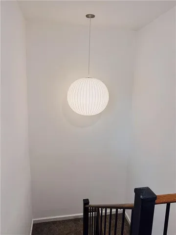 a room with a chair and a window