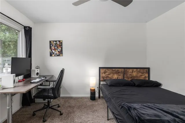 a bedroom with a workspace