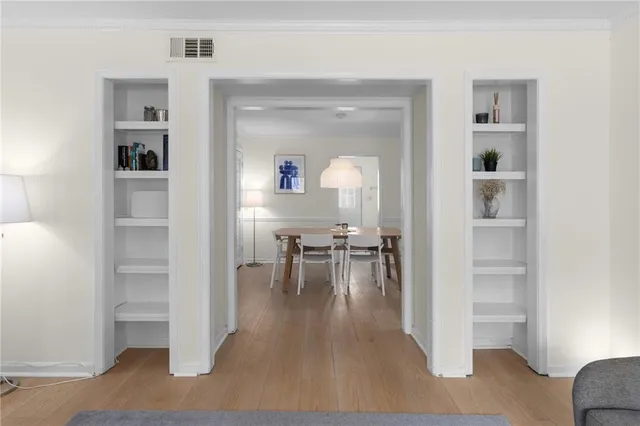 a dining room with furniture and view of bedroom