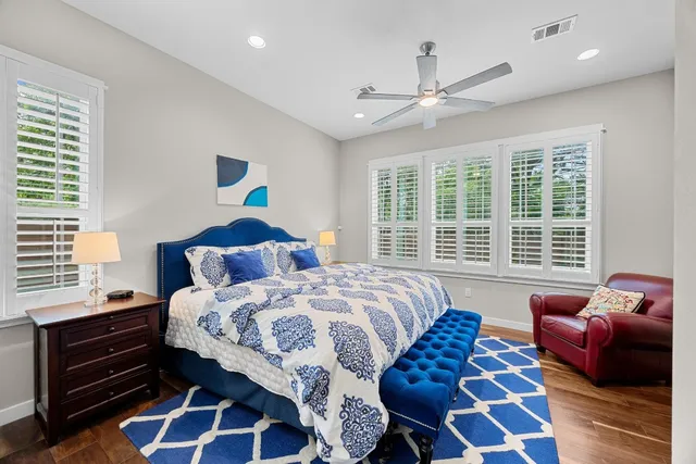 a bedroom with bed and a window