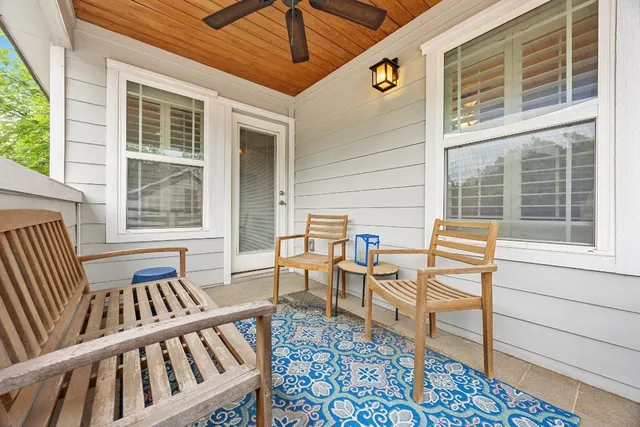 a balcony view with a seating space