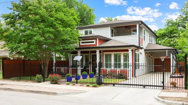 a view of a house with a iron gate