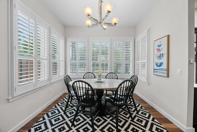 a view of a dining room with furniture window and outside view