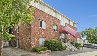 a view of a building with a street