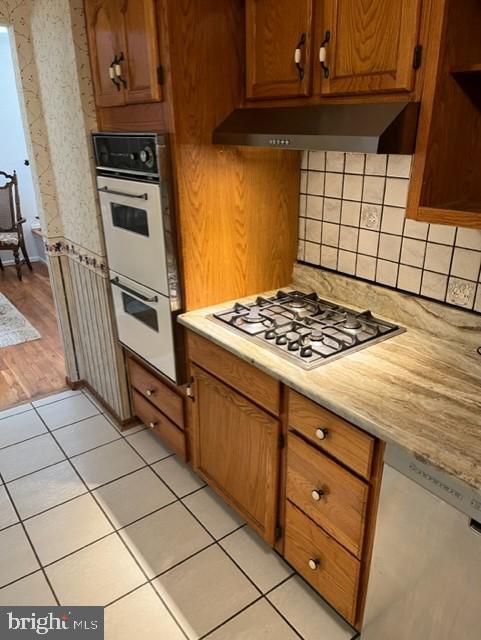 10 Blue Devil Lane Hamilton, NJ 08619 - Photo 7 of 16 a kitchen with granite countertop a stove and a cabinets