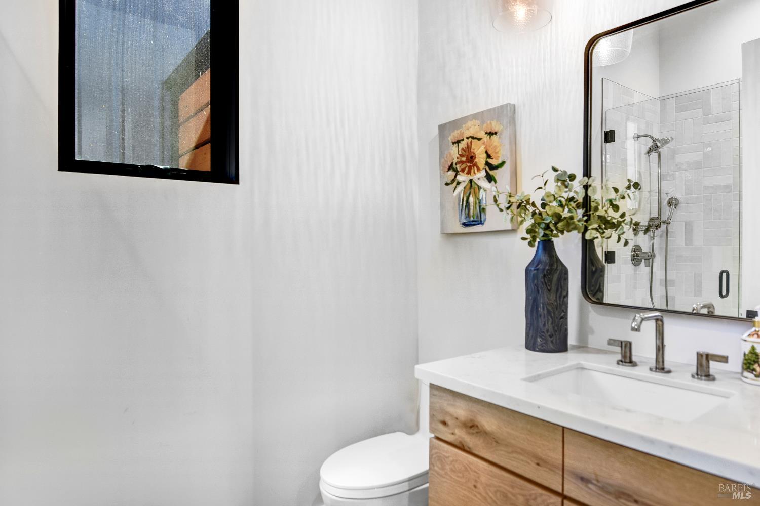 85 Trinity Road Glen Ellen, CA 95442 - Photo 28 of 62 a bathroom with a toilet sink and mirror