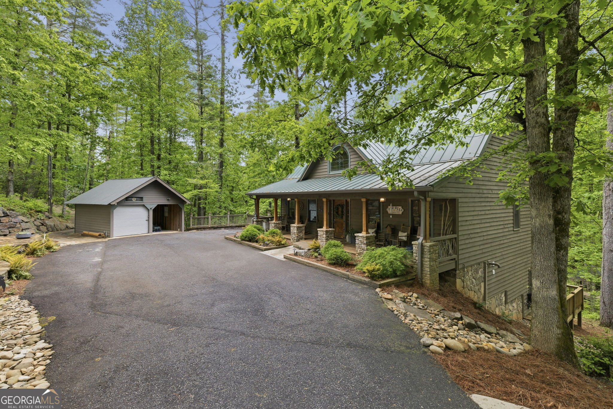 634 Little Hawk Road Sautee Nacoochee, GA 30571 - Photo 2 of 54 a front view of a house with yard and trees