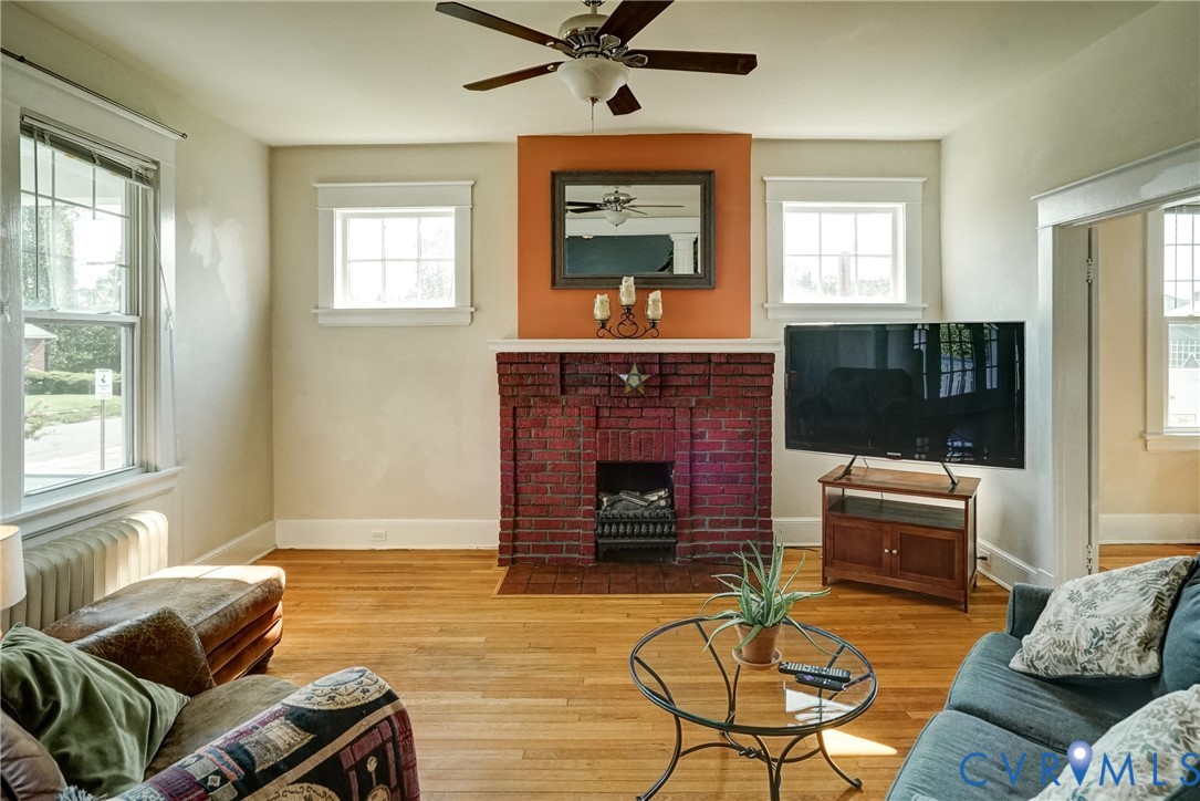 801 Edgehill Road Richmond, VA 23222 - Photo 9 of 21 Hardwood flooring, brick fireplace, ceiling fan, a