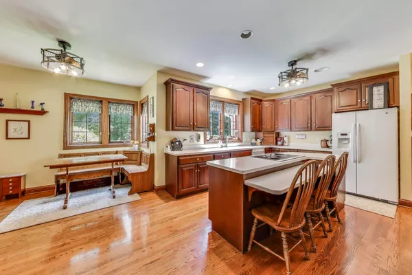 a living room with furniture a flat screen tv and a window