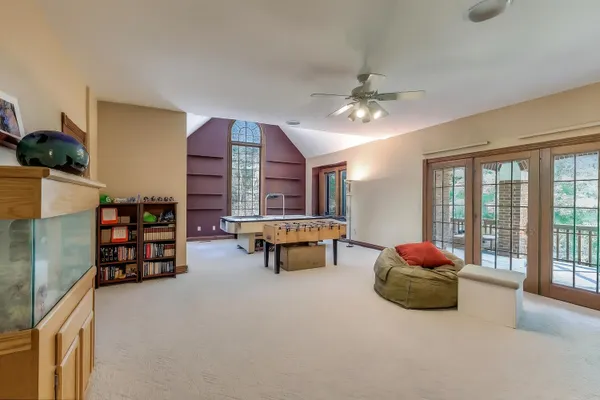 a bedroom with furniture and a wooden floor