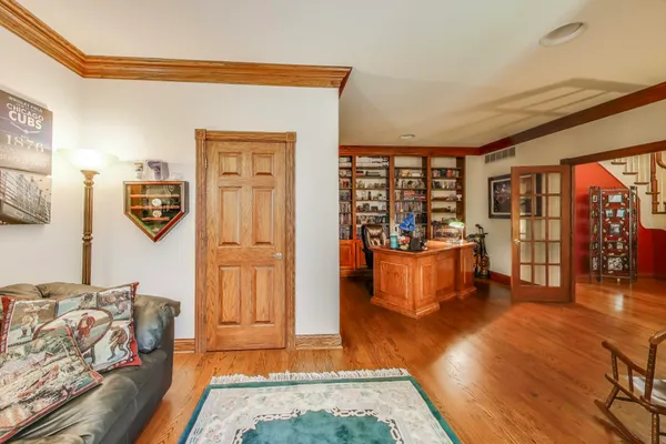 a bedroom with a bed dresser and a large mirror